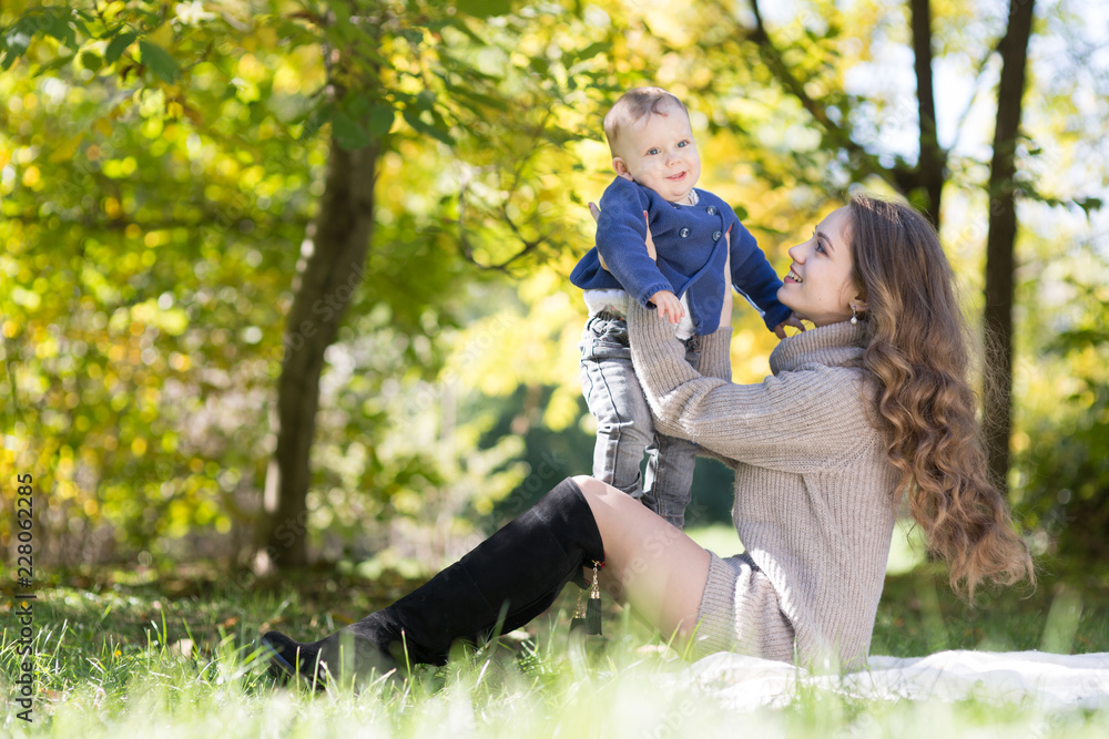 Fototapeta premium mother with baby in autumn park
