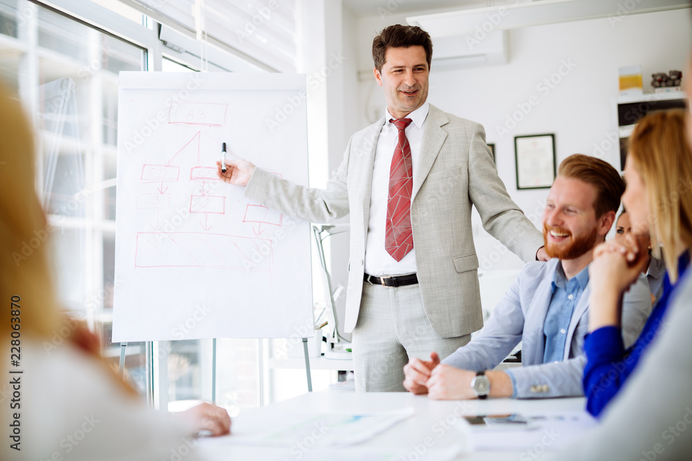 Group of business people working as team in office Group of business people working as team in office