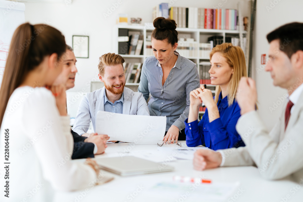 Group of business people working as team in office