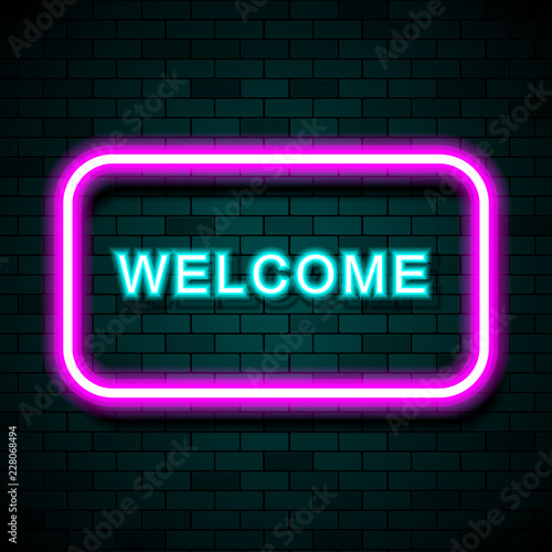 Neon sign with the word Welcome on brick wall background