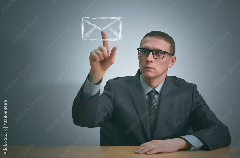 Businessman pointing on a email symbol by his index finger. Get letter. Businessman pointing on a email symbol by his index finger. Get letter.