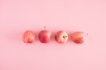 Autumn composition. Apples on pastel pink background. Autumn, fall creative concept. Flat lay, top view, copy space 