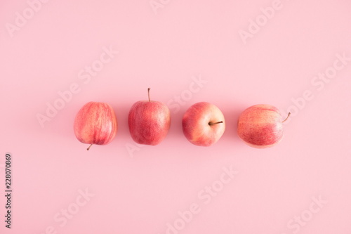 Autumn composition. Apples on pastel pink background. Autumn, fall creative concept. Flat lay, top view, copy space 