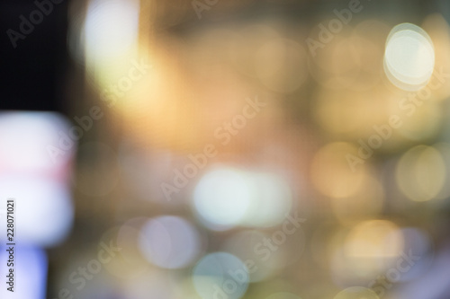 Blurred abstract background of bokeh lights in Christmas time. Can be used for background or product presentation.