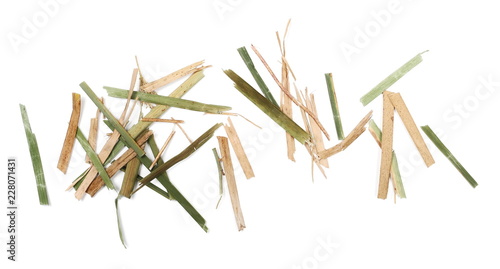 Green and yellow cut grass stems, pieces isolated on white background and organic texture, top view