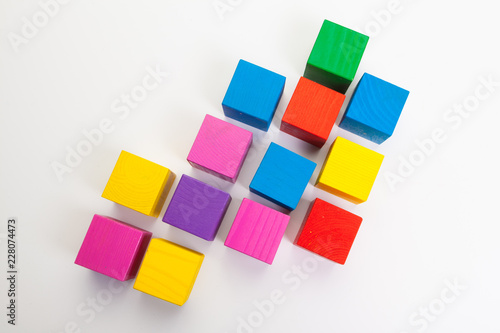 Colorful wooden building blocks isolated on white background