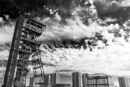 Historical headframe composed inside a contemporary architecture
