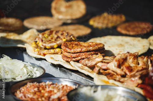 Freshly Serbian burger, called pljeskavica and meat,  traditional Serbian street food  photo