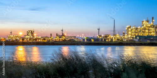 Chemical plant long exposure landscape at dusk photo