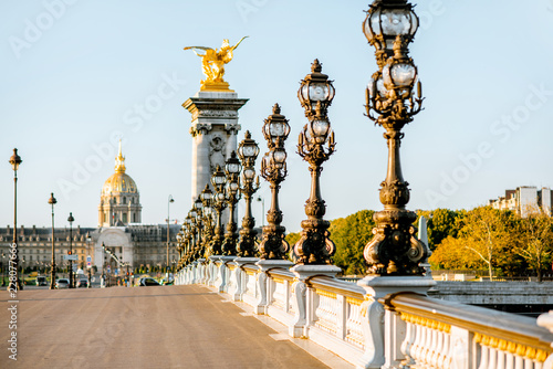 Alexandre bridge on Seine river with Residence of the Invalids on the background during the morning light in Paris