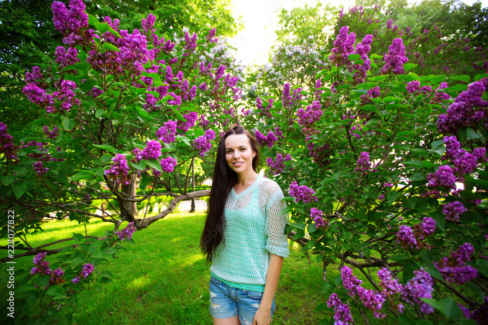 Beautiful girl with flowering trees in the park. Beautiful girl with flowering trees in the park.