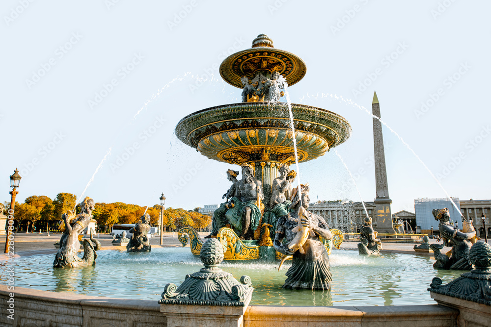 Maritime fountain on Concordia square with Luxor Obelisk on the background during the morning light in Paris