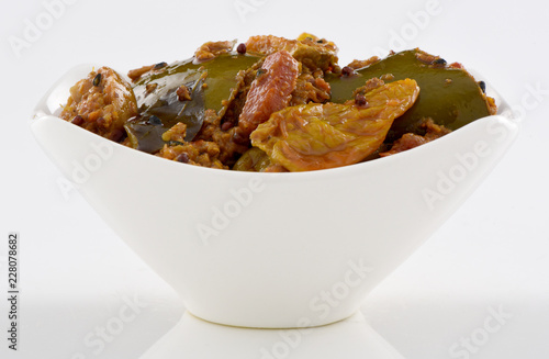 Mix Achar, A pure Desi traditional dish of mix vegetables stuffed with spices & dipped in thick oil and necessary for every dastarkhan.   photo