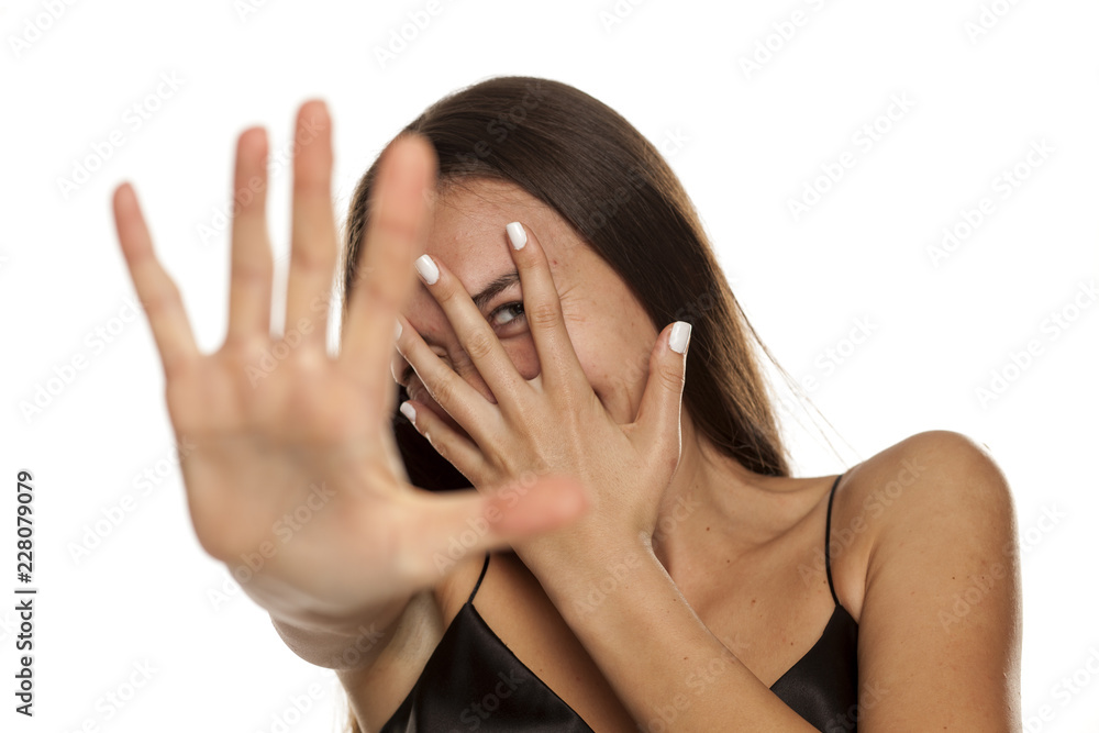 Portrait of young beautiful ashamed woman on white backgeound Portrait of young beautiful ashamed woman on white backgeound