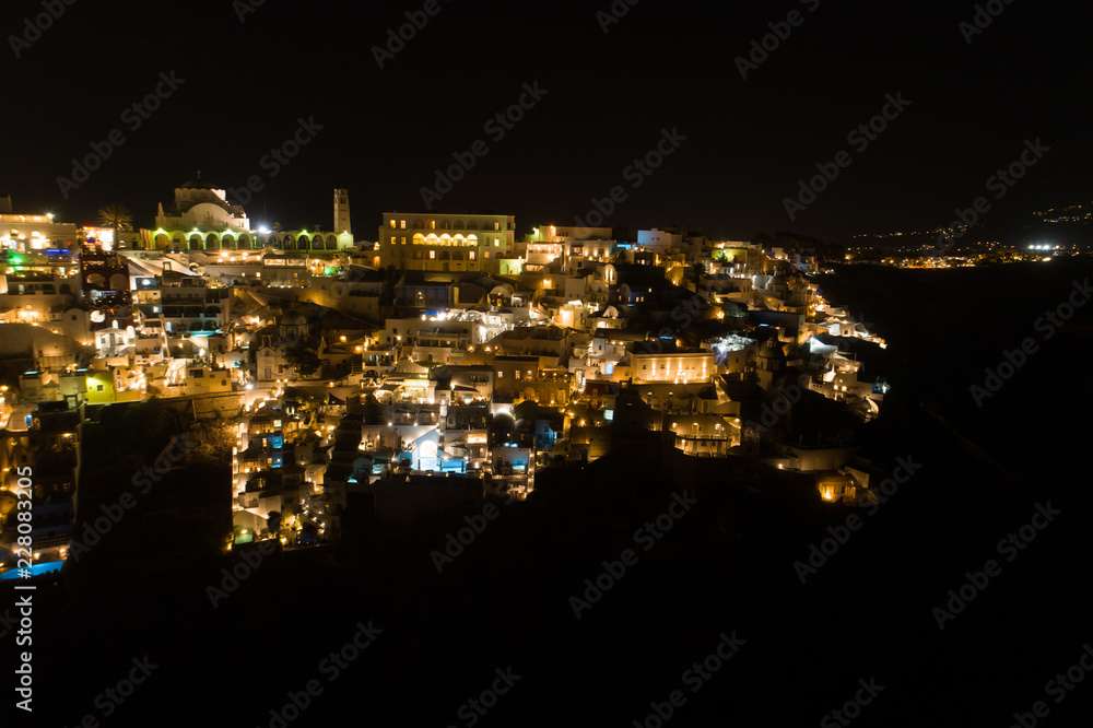 Aerial view of famous Greek resort Thira at night.