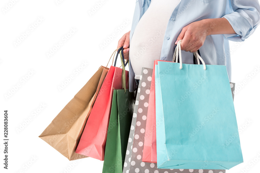 cropped view of pregnant woman with shopping bags isolated on white