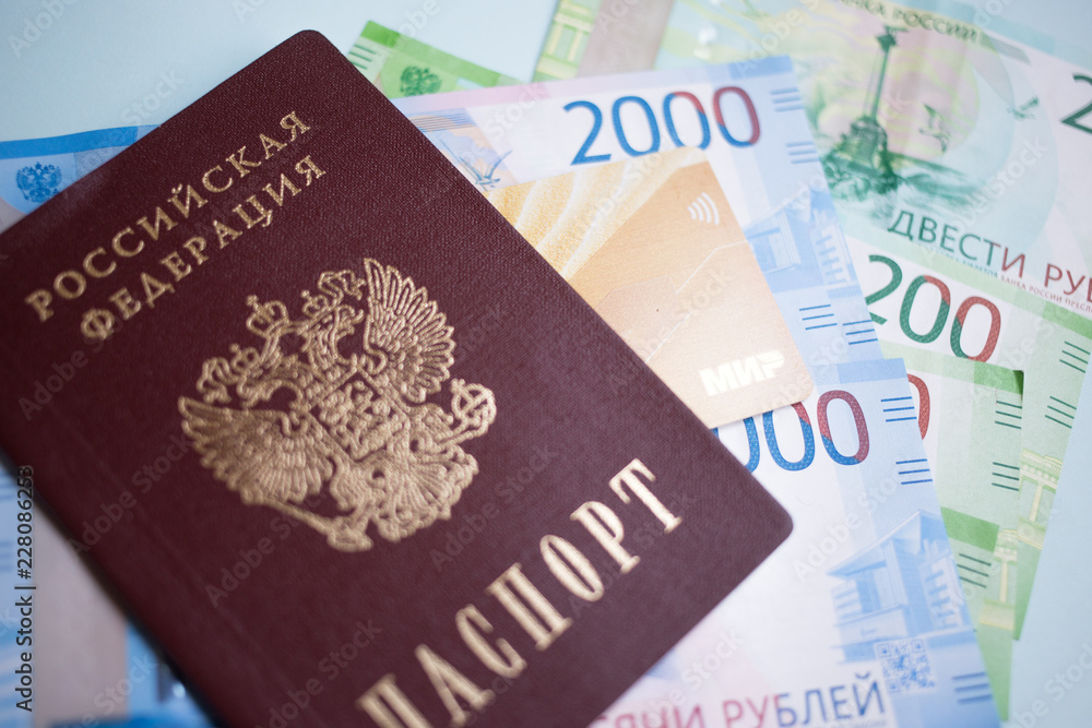 Moscow, Russia- 08 28 2018: Russian passport. The Russian Currency, including the new 2000 ruble-denominated promissory notes. The MIR credit card Moscow, Russia- 08 28 2018: Russian passport. The Russian Currency, including the new 2000 ruble-denominated promissory notes. The MIR credit card