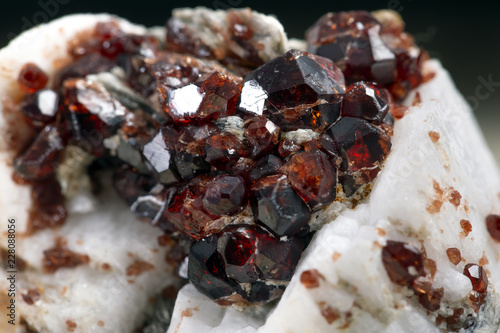 Uncut and rough deep red rhodolite garnet gemstone.