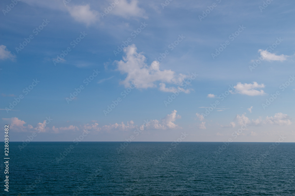 clouds blue sky above ocean and sea waves
