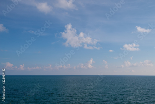 clouds blue sky above ocean and sea waves