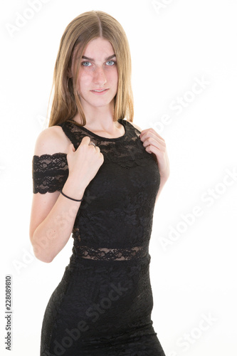 proud sexy young woman in black glamorous dress in white background © OceanProd