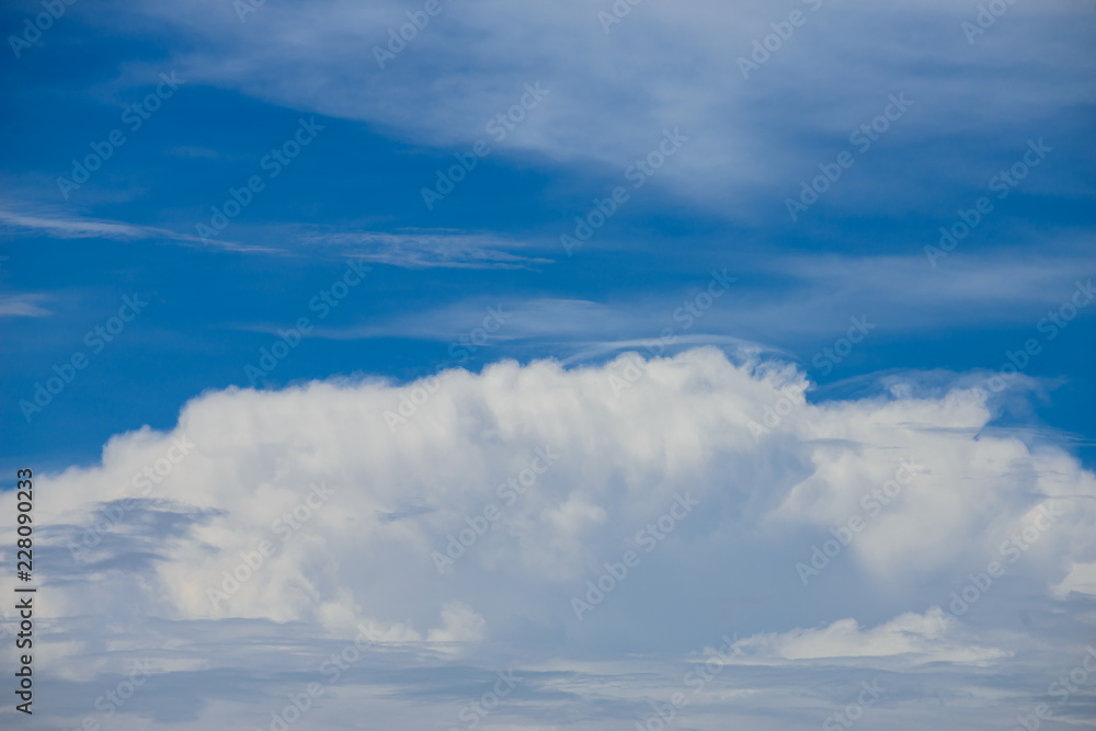 Rain clouds forming with blue sky background