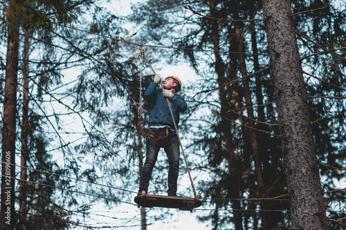 Man in a park on a rope town. country park for sports