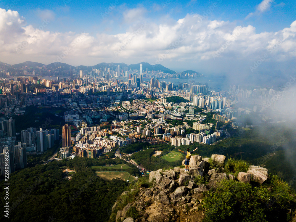 Man enjoying Hong Kong city view from the Lion rock aerial