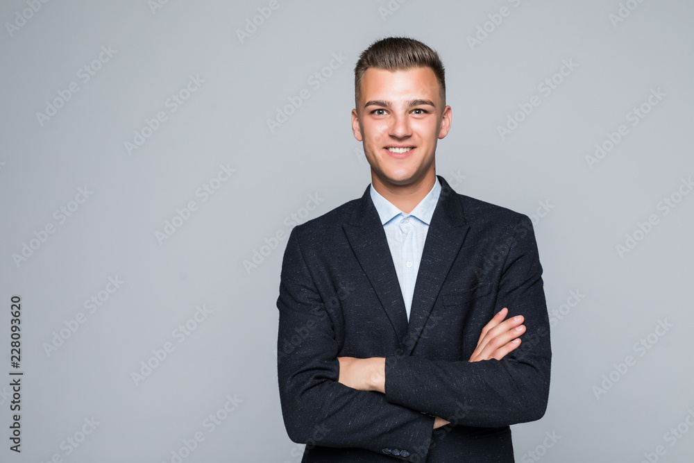 Portrait of businessman with crossed hands, isolated on white background. Concept of leadership and success Portrait of businessman with crossed hands, isolated on white background. Concept of leadership and success