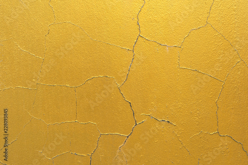 Cement background with a texture of gold wall
