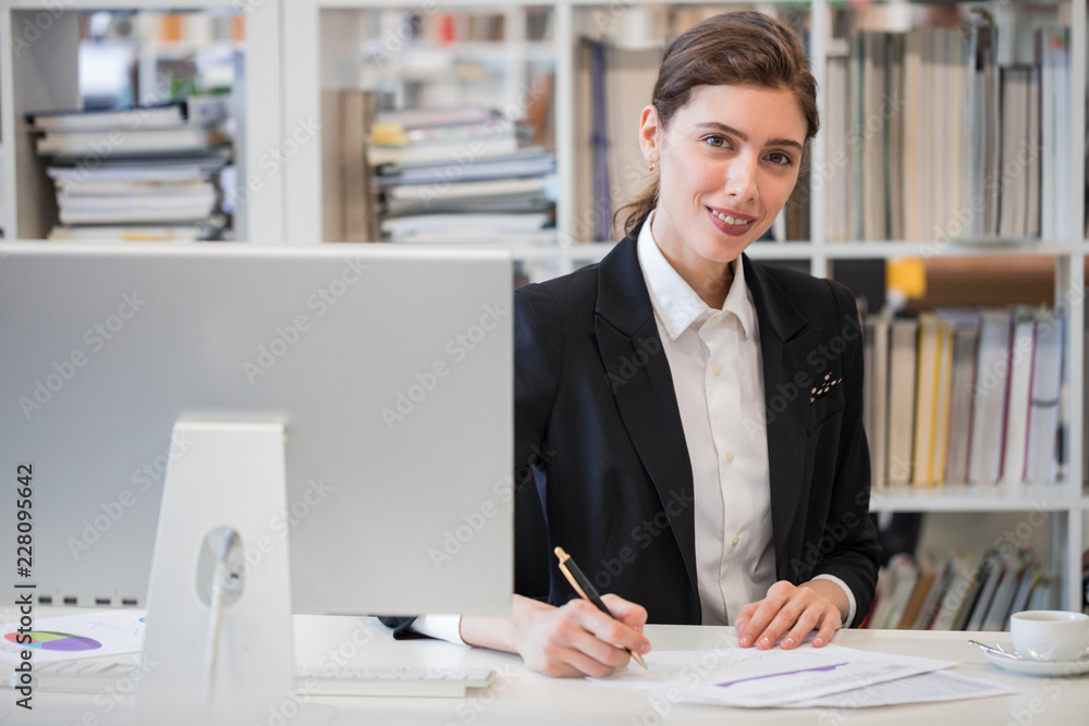 Portrait of business woman in office Portrait of business woman in office