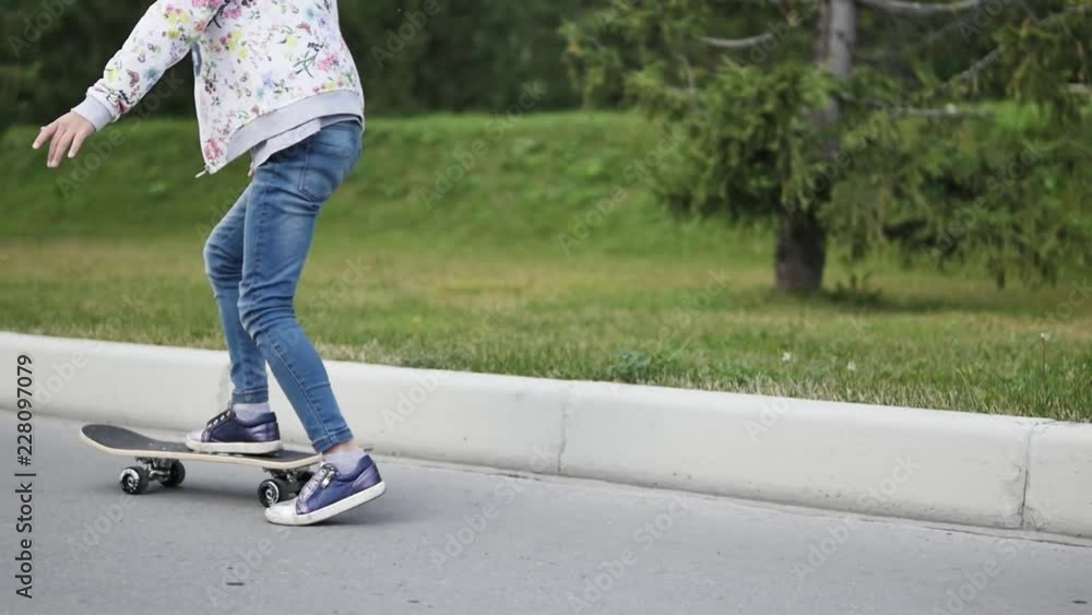 Beautiful young girl having fun with a skateboard Beautiful young girl having fun with a skateboard