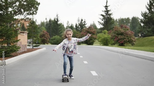 Wallpaper Mural Beautiful young girl having fun with a skateboard Torontodigital.ca