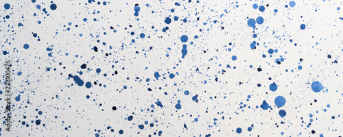 White and blue dots acrylic painted abstract background. Trendy unique backdrop