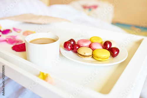 Romantic breakfast with macarons and coffee
