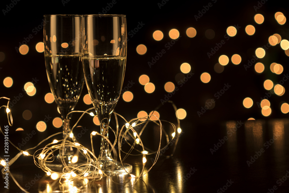 New Year toast champagne led lights,  bokeh lights background - obrazy, fototapety, plakaty 