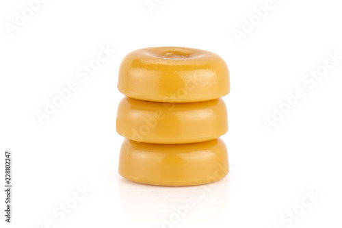 Group of three whole caramel cream candy butterscotch variety isolated on white background