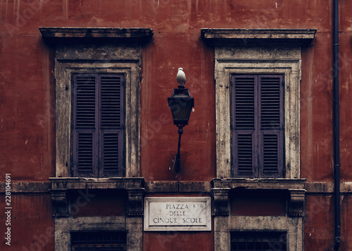 historical House Facade in Rome with a Seagull on a Lantern