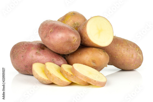 Group of lot of whole one half four slices of fresh red potato francelina variety stack isolated on white background