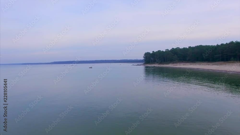 Top aerial view. Lohusalu Bay on Baltic Sea coast on a cloudy autumn day with a backdrop of green pines, part 1