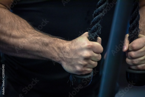 Man doing exercises with rope