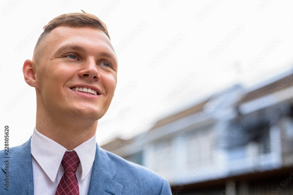 Portrait of young businessman in the streets outdoors Portrait of young businessman in the streets outdoors