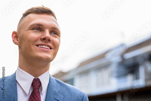 Portrait of young businessman in the streets outdoors