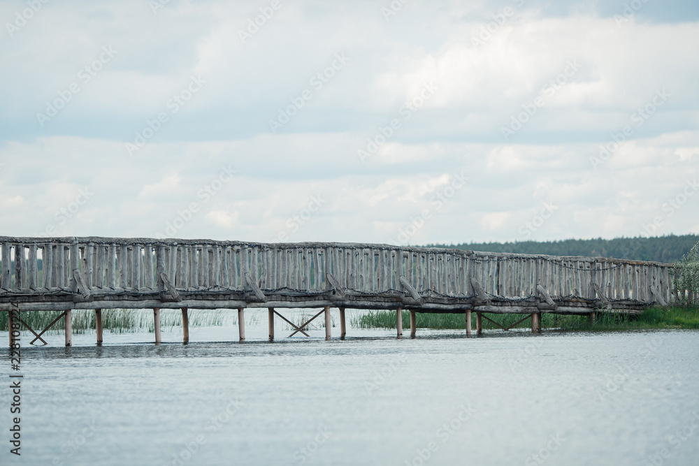 wooden bridge over the river, landscape with a bridge
