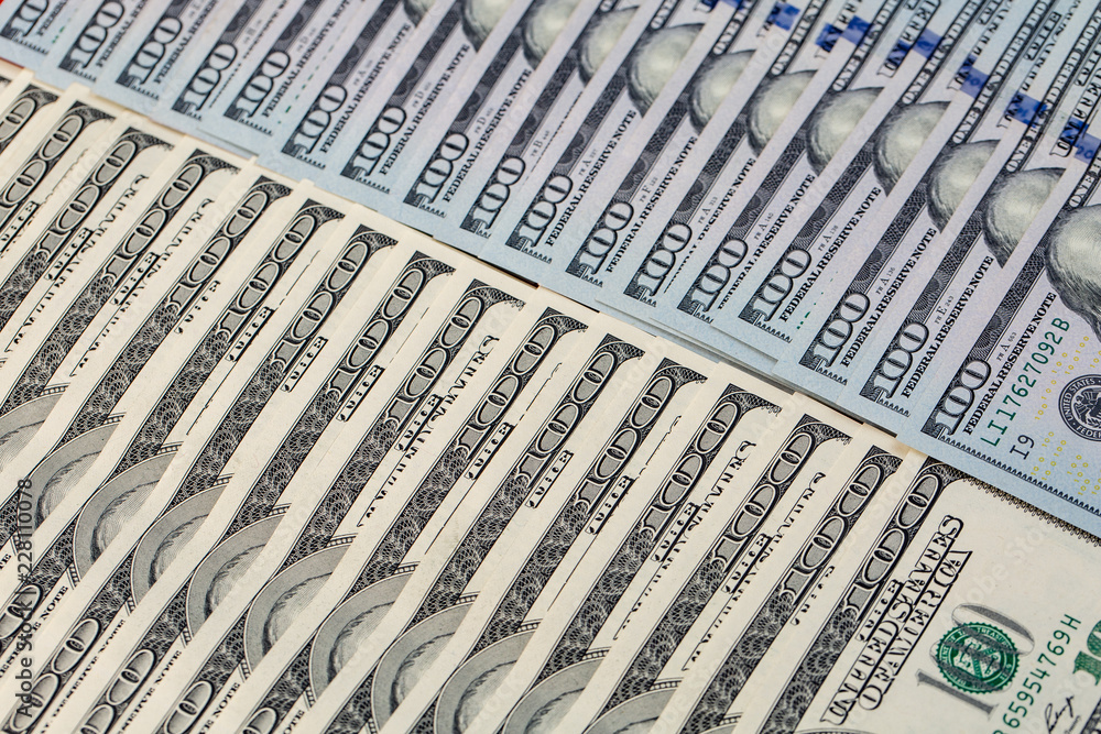 a pile of American paper hundred-dollar bills as an element of the world financial system a pile of American paper hundred-dollar bills as an element of the world financial system