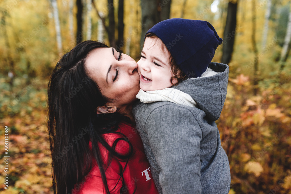 happy mather and child in autumn park happy mather and child in autumn park