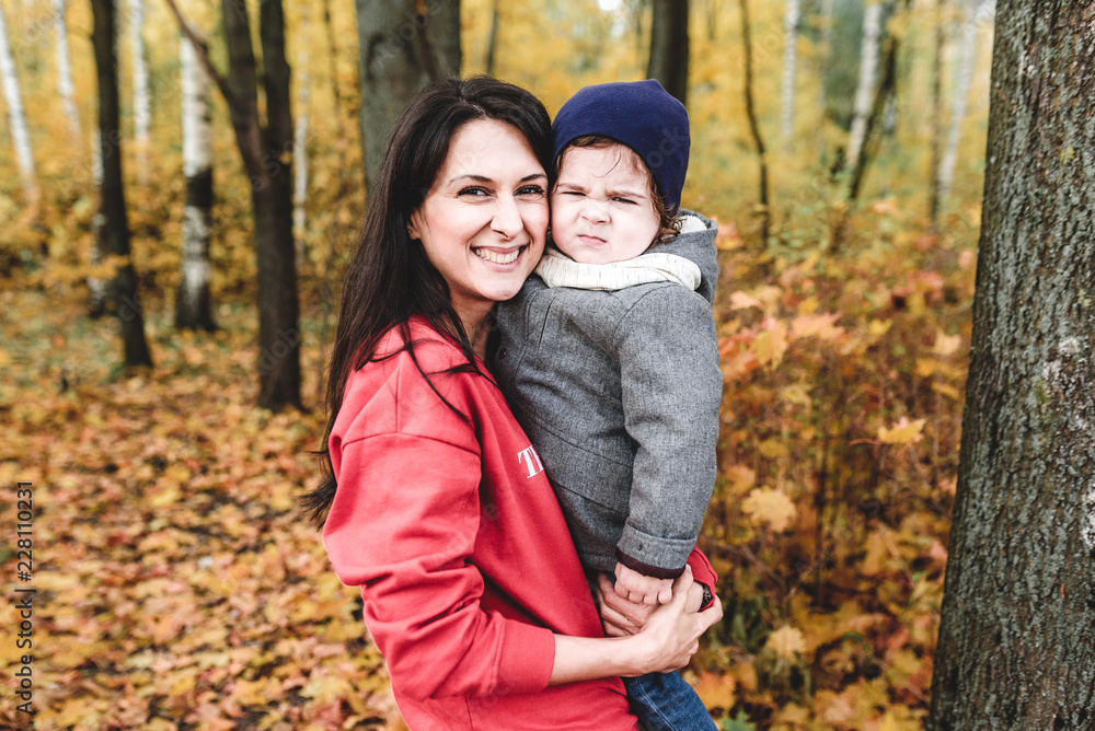 happy mather and child in autumn park happy mather and child in autumn park
