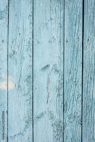 Wooden surface with old blue paint. Close-up. Background. Texture