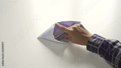 Envelope bribe find in in folders with documents on table the money banknotes in nominal of 500 euros.