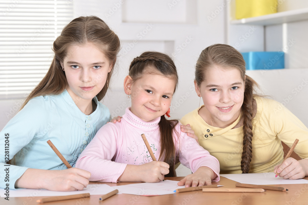 Portrait of cute beautiful girls doing homework Portrait of cute beautiful girls doing homework